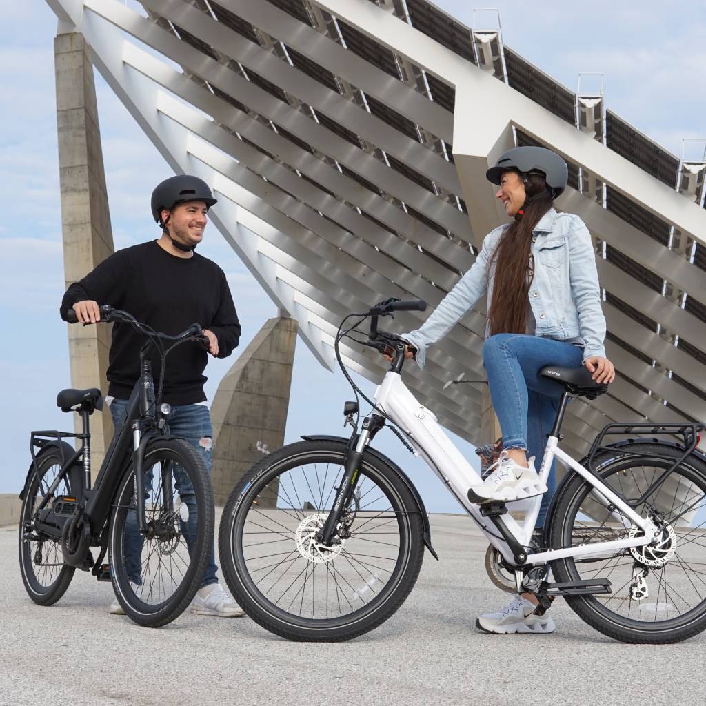 Man and woman with black and white Legend Milano e-bikes